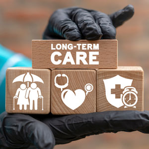 Wooden blocks labeled 'Long-Term Care' with icons for elderly care